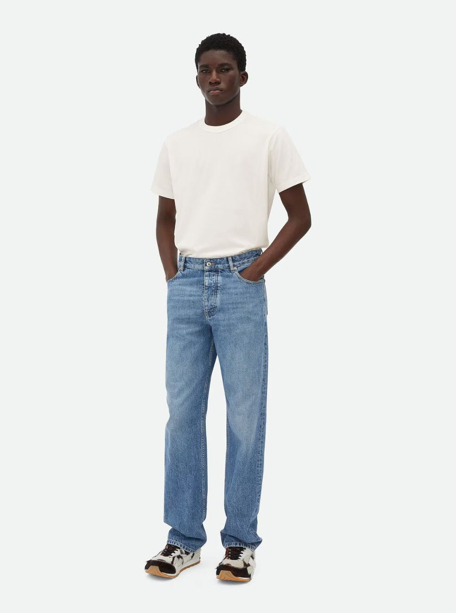 Close-up of Bottega Veneta pants hardware and fine stitching