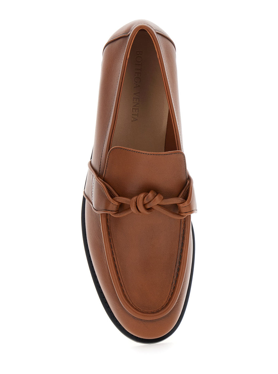 Close-up of Bottega Veneta slides hardware and fine stitching