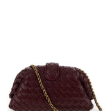 Close-up of Bottega Veneta clutches hardware and fine stitching