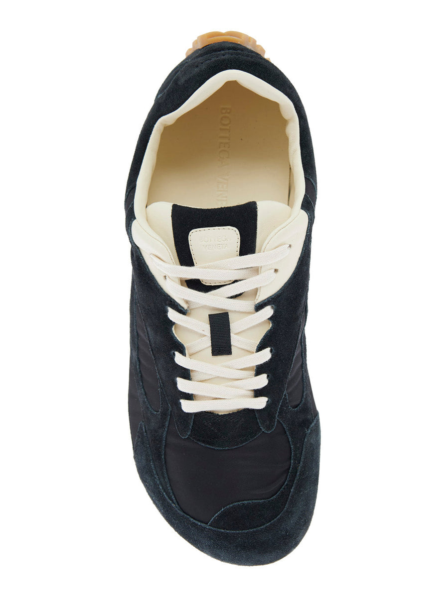 Close-up of Bottega Veneta athletic hardware and fine stitching
