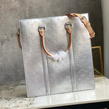 Handle and strap detail of modern statement women's handbag – women's designer-style accessory