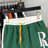 Close-up detail shot of Rhude luxury clothing with label-forward styling