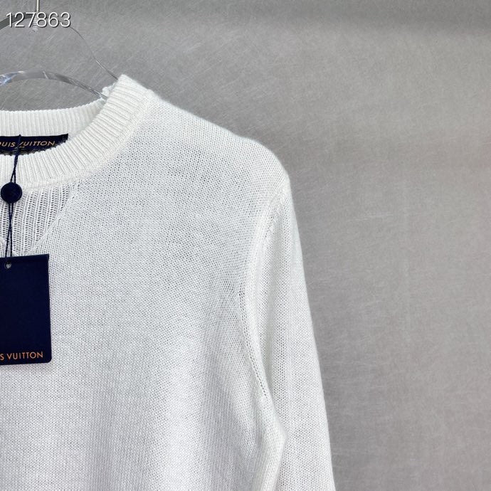 Flat lay presentation of Louis Vuitton luxury clothing with runway-inspired design