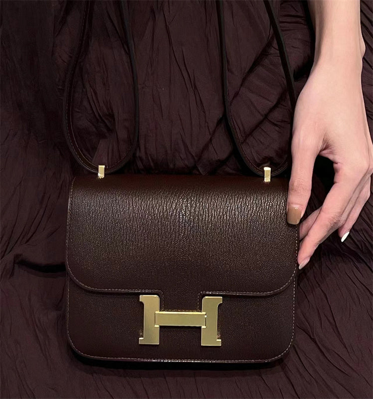Side view of streamlined structured handbag