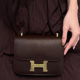 Side view of streamlined structured handbag