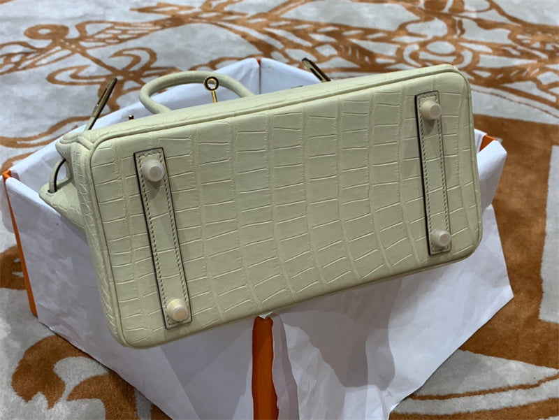 Side view of refined structured handbag
