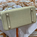 Side view of refined structured handbag