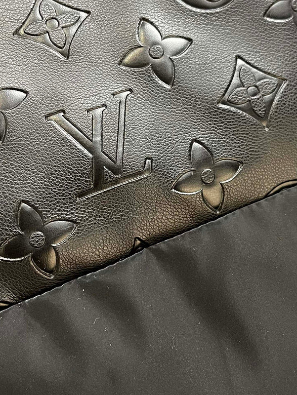Flat lay presentation of Louis Vuitton luxury clothing with logo-detail design