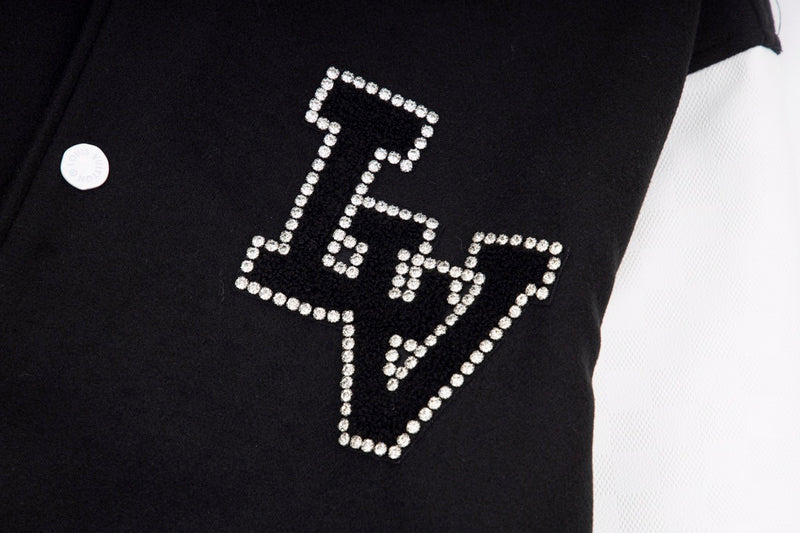 Flat lay presentation of Louis Vuitton luxury clothing with contemporary cut
