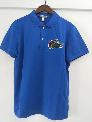 Flat lay presentation of Lacoste luxury clothing with tailored silhouette