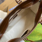 Side profile of modern chic women's handbag – women's designer-style accessory