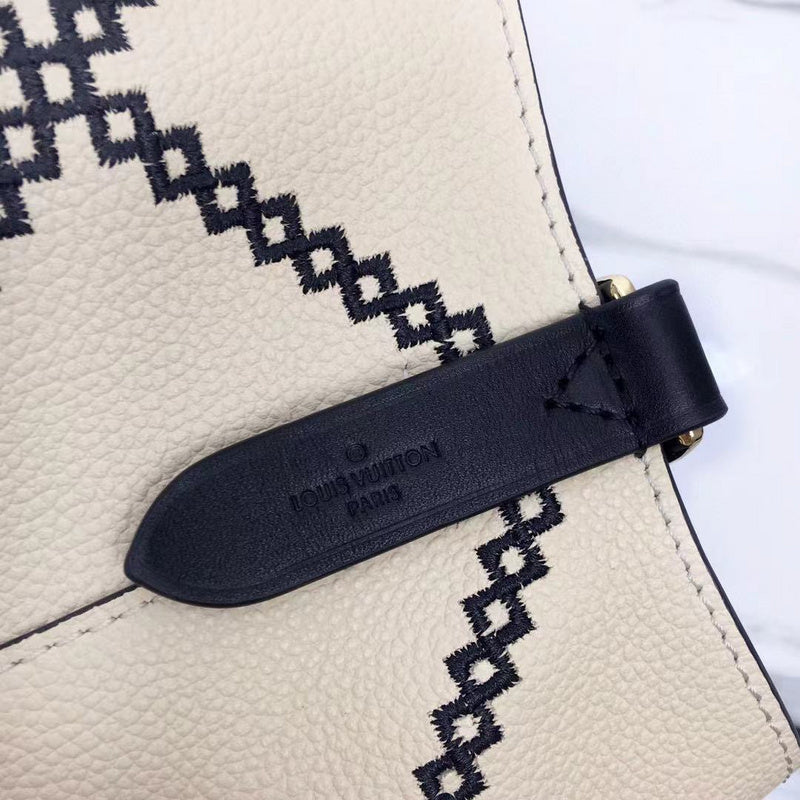 Side profile of structured refined women's handbag – women's luxury handbag