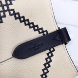 Side profile of structured refined women's handbag – women's luxury handbag
