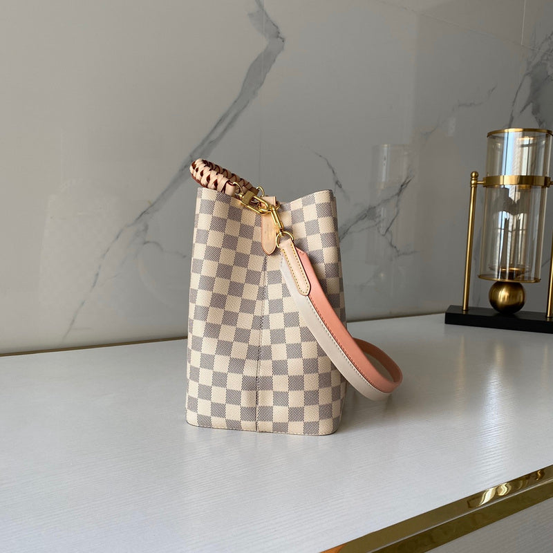 Handle and strap detail of modern chic women's handbag – women's statement bag
