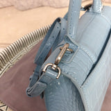 Top view of structured polished women's handbag – women's designer-style accessory