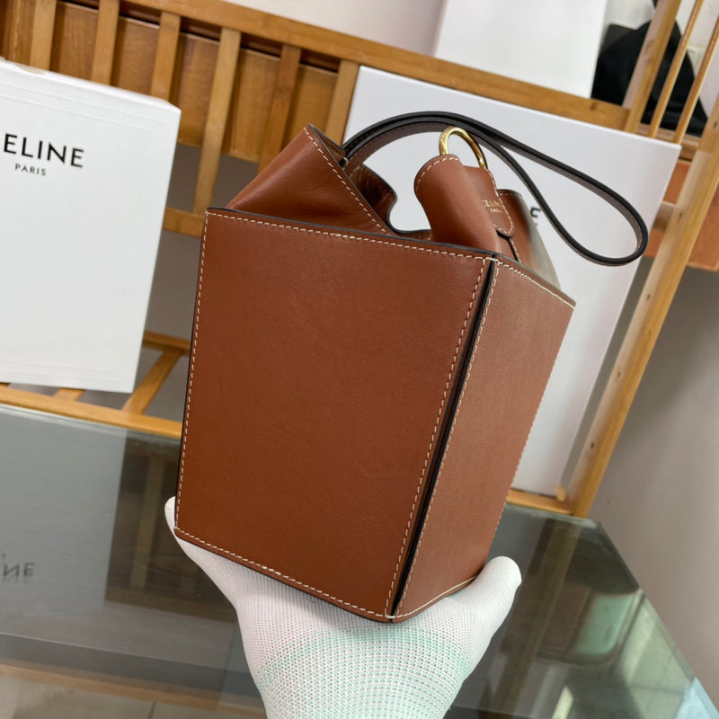 Styled lifestyle shot of structured signature women's handbag – women's designer-style accessory