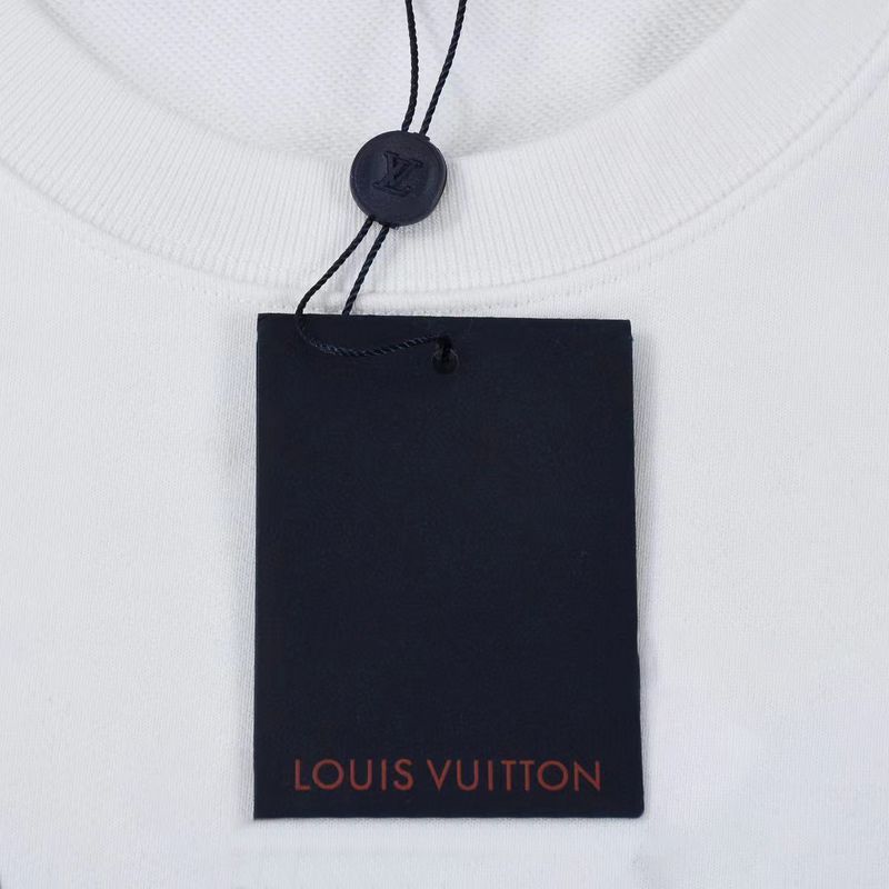 Close-up detail shot of Louis Vuitton luxury clothing with signature branding
