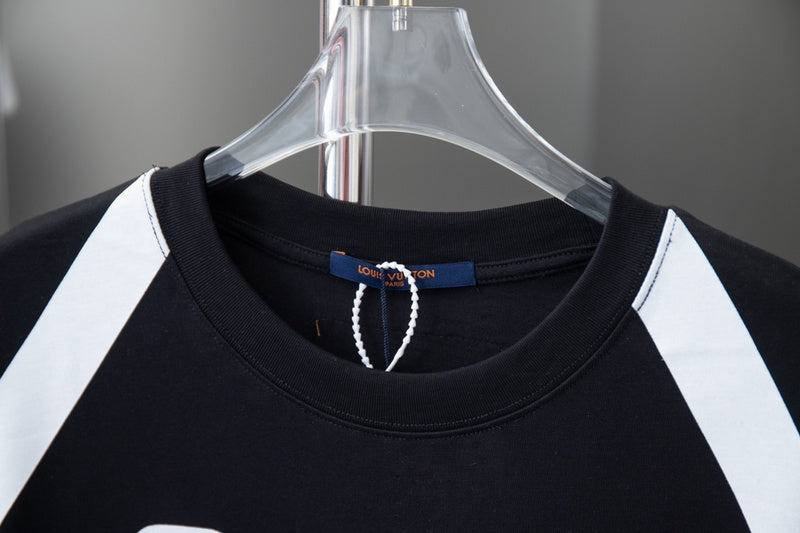 Close-up detail shot of Louis Vuitton cotton t-shirt with signature branding