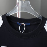 Close-up detail shot of Louis Vuitton cotton t-shirt with signature branding