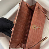 Side view of polished structured handbag