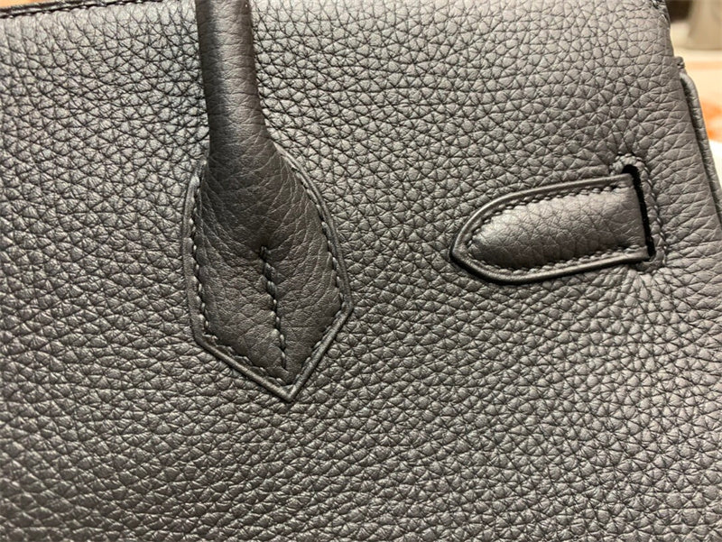 Side view of structured structured handbag