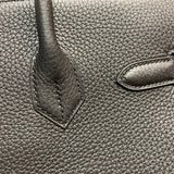 Side view of structured structured handbag