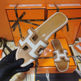 Hermès Chocolate Brown Slide Sandals - Close-Up Texture View