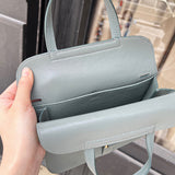 Side view of modernist structured handbag