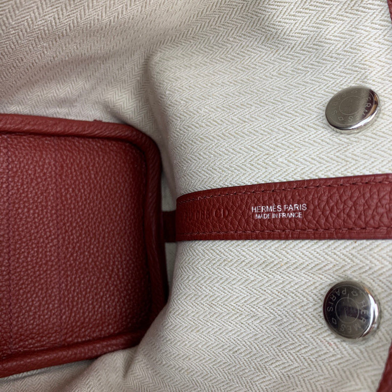 Side view of considered structured handbag