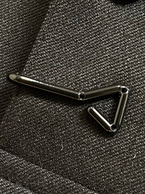 Back view of Louis Vuitton luxury clothing with signature branding