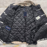 Front view of Louis Vuitton luxury clothing with label-forward styling