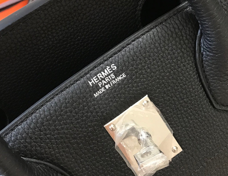 Side view of structured structured handbag