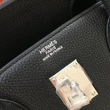 Side view of structured structured handbag