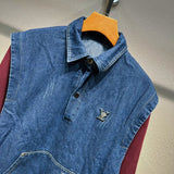 Close-up detail shot of Louis Vuitton luxury clothing with logo-detail design
