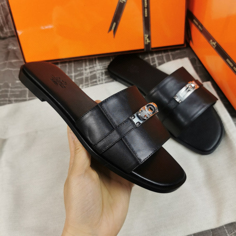 Hermès Burgundy Flat Thong Sandals - Lifestyle Styling Shot