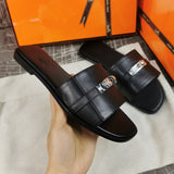 Hermès Burgundy Flat Thong Sandals - Lifestyle Styling Shot