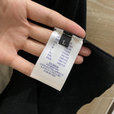 Close-up detail shot of Louis Vuitton luxury clothing with runway-inspired design