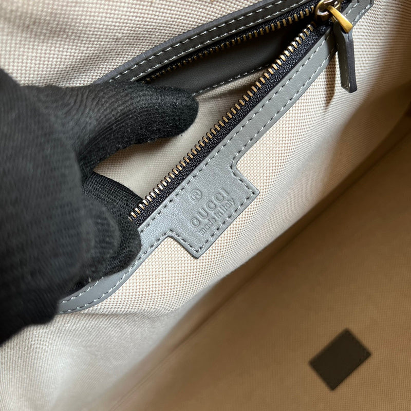 Side view of contemporary structured handbag