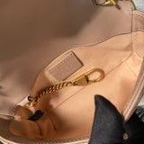 Close-up detail of classic polished women's handbag – women's statement bag