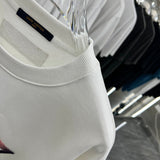 Flat lay presentation of Louis Vuitton luxury clothing with relaxed-fit cut