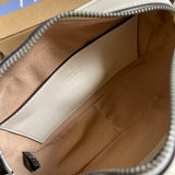 Side profile of statement everyday-luxe women's handbag – women's designer-style accessory