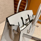 Side view of considered structured handbag