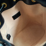Side profile of elevated signature women's handbag – women's designer-style accessory