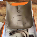  structured top-handle bag styled with outfit