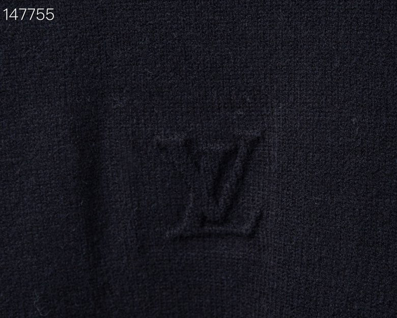 Flat lay presentation of Louis Vuitton luxury clothing with signature branding