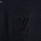 Flat lay presentation of Louis Vuitton luxury clothing with signature branding