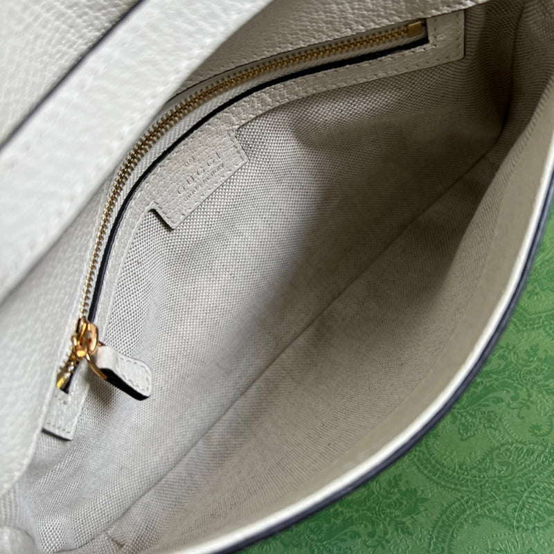 Side profile of chic polished women's handbag – women's statement bag