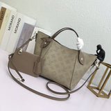 Side profile of premium everyday-luxe women's handbag – women's statement bag