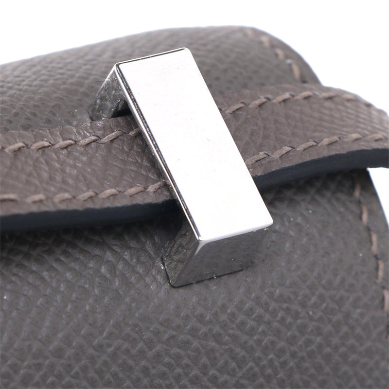 Side view of fluid structured handbag