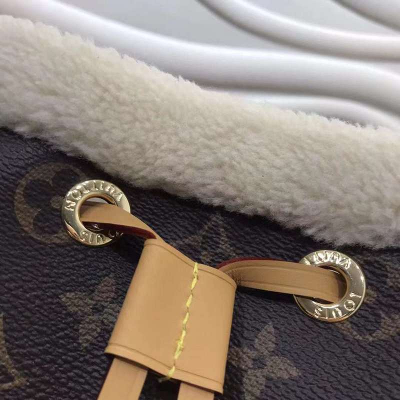 Back view of modern signature women's handbag – women's luxury accessory